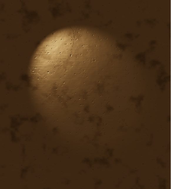 Aged bronze under a narrow warm spotlight